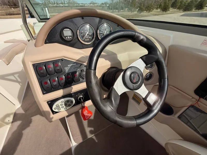 Slide: The Image of Steering console of a 2003 Regal 2000 Bowrider boat. - 11