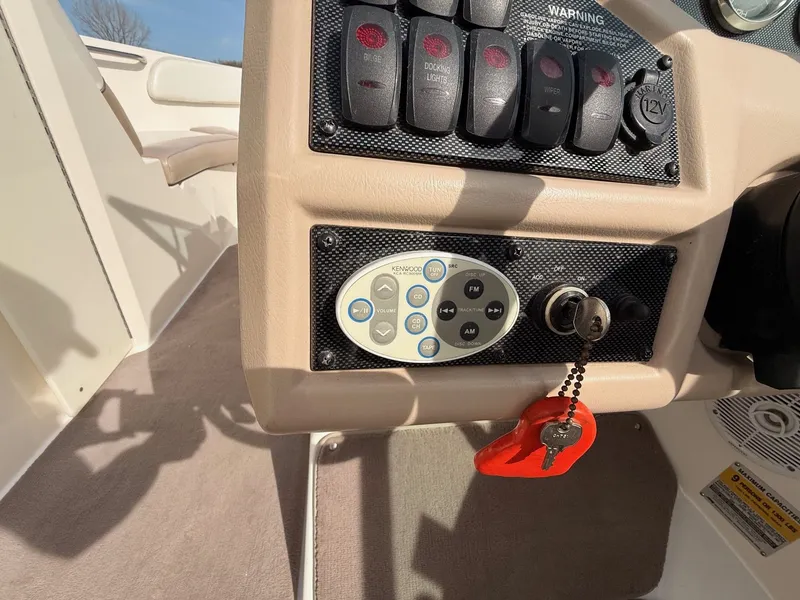 Slide: The Image of Dashboard of a 2003 Regal 2000 Bowrider boat with key switch. - 13