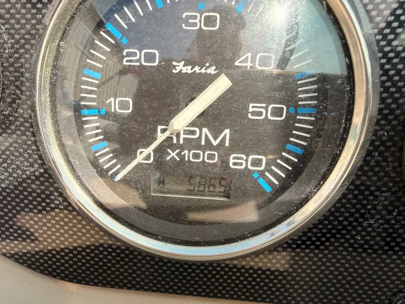 Slide: The Image of Tachometer of a 2003 Regal 2000 Bowrider boat displaying RPM. - 15