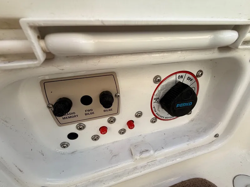 Slide: The Image of Control panel of a 2003 Regal 2000 Bowrider with switches and Perko knob. - 17