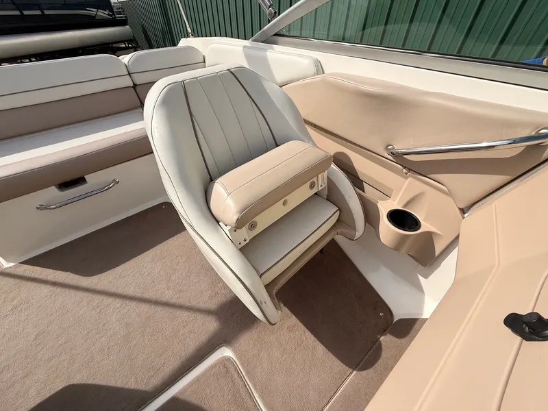Slide: The Image of Interior of a 2003 Regal 2000 Bowrider boat with beige seating. - 18