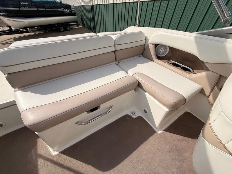 Slide: The Image of Interior of a 2003 Regal 2000 Bowrider boat with beige seating. - 21