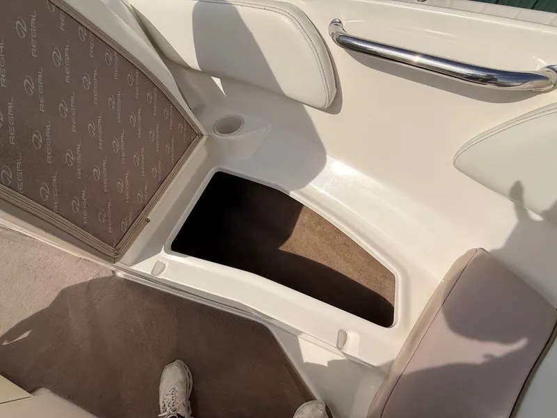 Slide: The Image of Interior of a 2003 Regal 2000 Bowrider boat with storage compartment. - 8