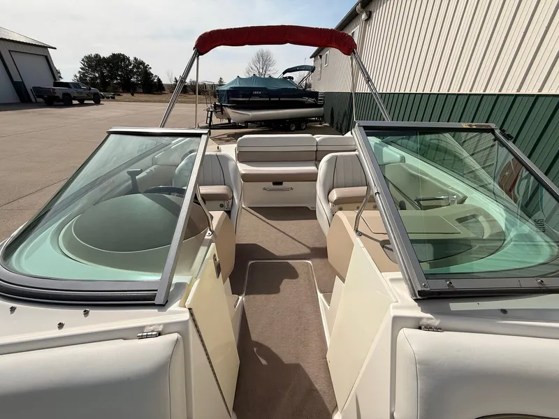Slide: The Image of Interior view of a 2003 Regal 2000 Bowrider boat on a parking lot. - 9