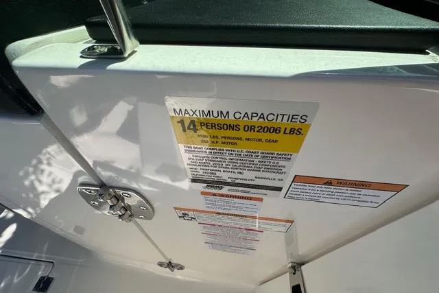Slide: The Image of 2023 Chaparral 270 OSX boat capacity label, maximum 14 persons or 2006 lbs. - 17