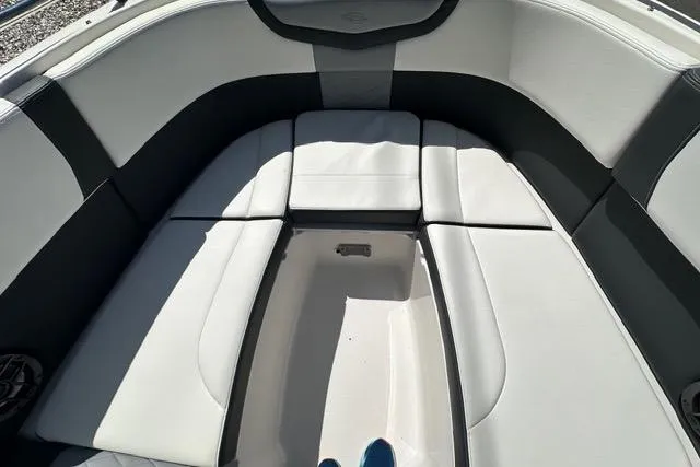 Slide: The Image of Interior seating of 2023 Chaparral 270 OSX boat, featuring cushioned upholstery. - 20