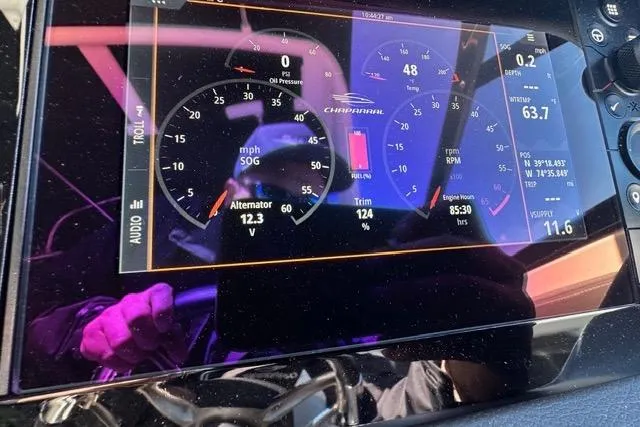 Slide: The Image of Dashboard display of 2023 Chaparral 270 OSX boat showing speed, trim, and engine metrics. - 25