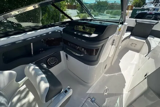 Slide: The Image of 2023 Chaparral 270 OSX boat interior with sleek design and modern dashboard. - 37