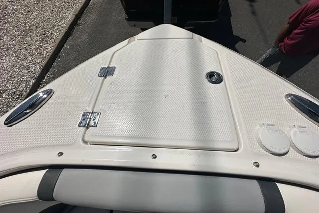 Slide: The Image of 2023 Chaparral 270 OSX boat deck with storage hatch and sleek design. - 42