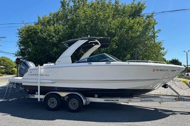 Slide: The Image of 2023 Chaparral 270 OSX boat on trailer, parked outdoors. - 6