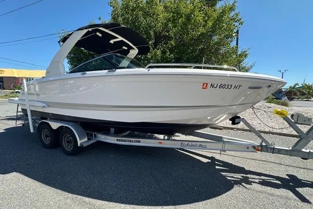 Slide: The Image of 2023 Chaparral 270 OSX boat on trailer, parked outdoors. - 7