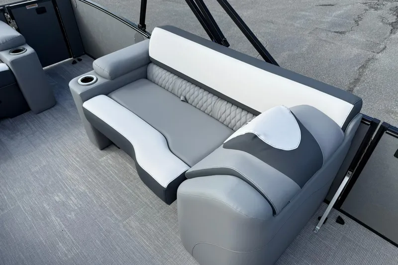 Slide: The Image of Luxurious seating on 2026 Avalon Catalina Elite 23 pontoon boat, featuring gray and white upholstery. - 13