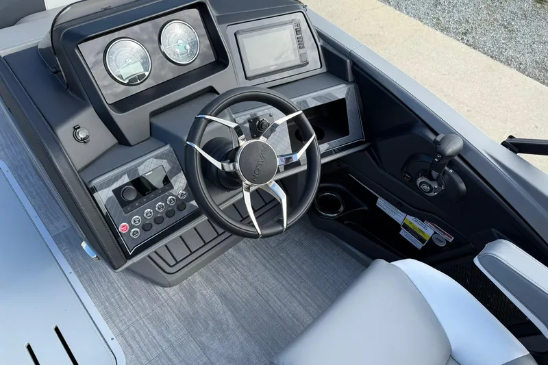 Slide: The Image of Cockpit of 2026 Avalon Catalina Elite 23 with modern steering and control panel. - 14