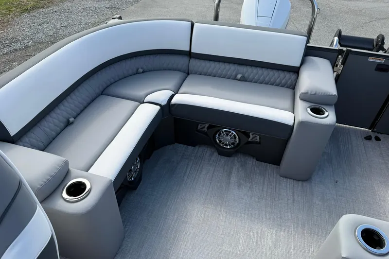 Slide: The Image of Luxurious seating on 2026 Avalon Catalina Elite 23 pontoon boat with cup holders and speakers. - 17