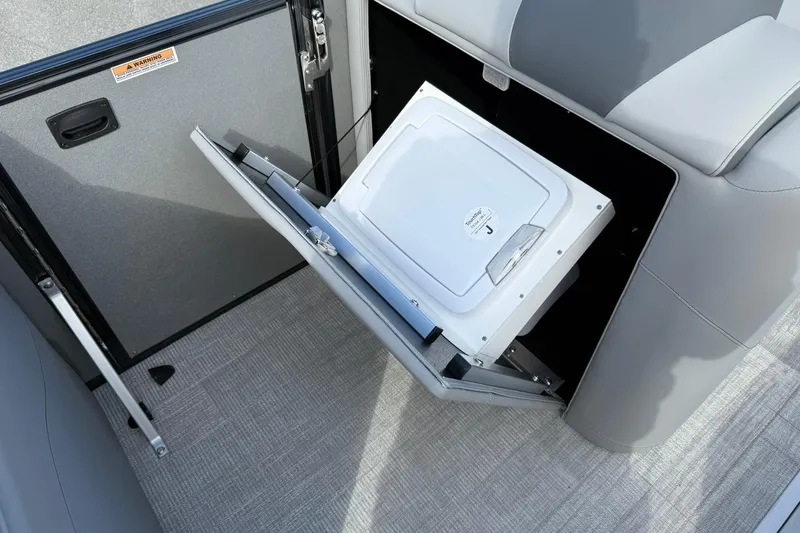 Slide: The Image of Avalon Catalina Elite 23 (2026) boat interior with built-in storage compartment. - 18