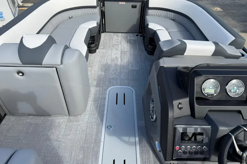 Slide: The Image of 2026 Avalon Catalina Elite 23 boat interior with luxurious seating and modern dashboard. - 19
