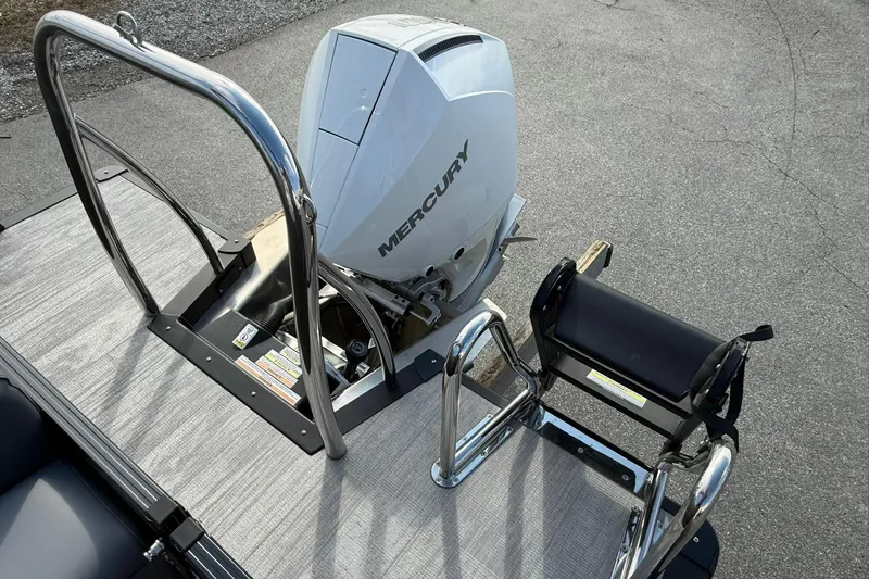 Slide: The Image of 2026 Avalon Catalina Elite 23 boat with Mercury outboard motor and swim ladder. - 20