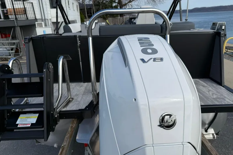 Slide: The Image of 2026 Avalon Catalina Elite 23 with powerful 250 V8 engine, docked by the water. - 4