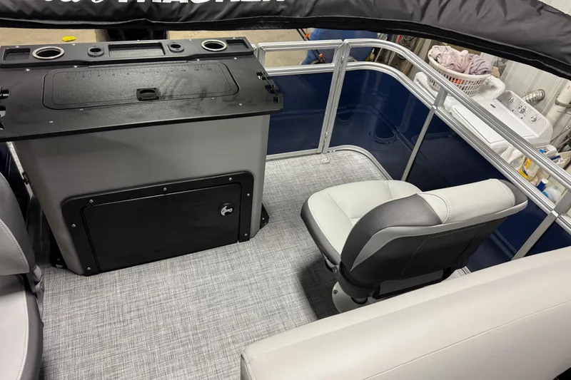 Slide: The Image of Interior of 2026 Sun Tracker SportFish 20 DLX pontoon boat with seating and console. - 12
