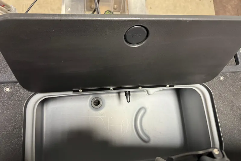 Slide: The Image of Open storage compartment on 2026 Sun Tracker SportFish 20 DLX boat. - 15