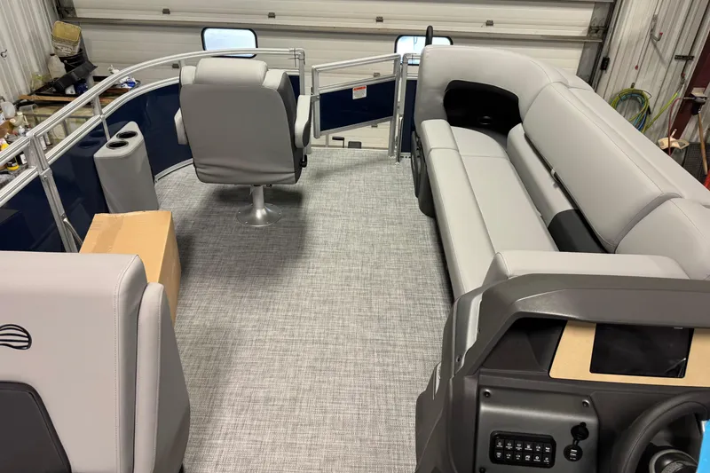 Slide: The Image of 2026 Sun Tracker SportFish 20 DLX interior with gray seating and modern helm. - 17