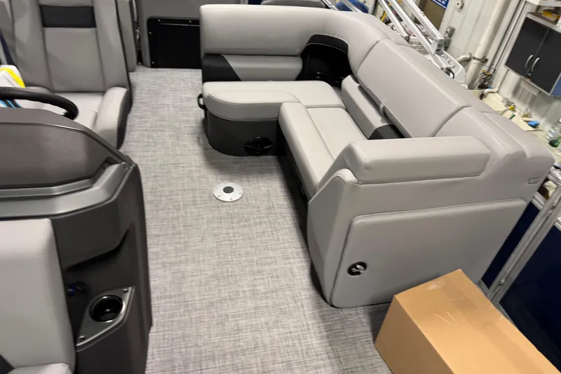 Slide: The Image of 2026 Sun Tracker SportFish 20 DLX interior with gray seating and modern design. - 8