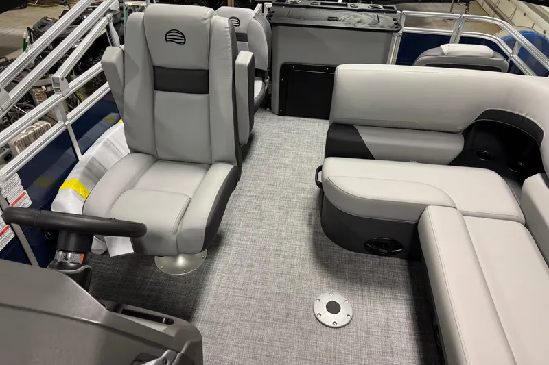 Slide: The Image of 2026 Sun Tracker SportFish 20 DLX interior with gray seating and modern design. - 9