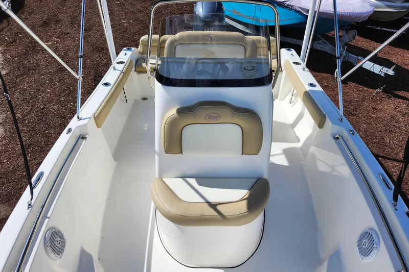 Slide: The Image of 2019 Key West 189 FS boat interior with beige seating and console. - 10