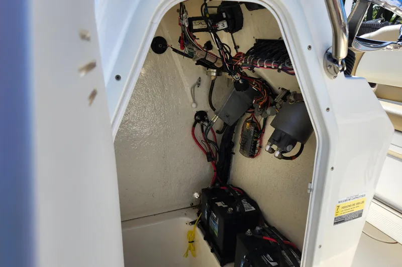 Slide: The Image of 2019 Key West 189 FS boat wiring and battery compartment interior. - 26