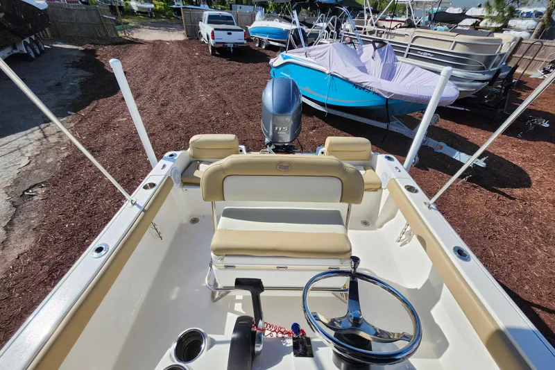 Slide: The Image of 2019 Key West 189 FS boat interior with steering wheel and seating. - 28