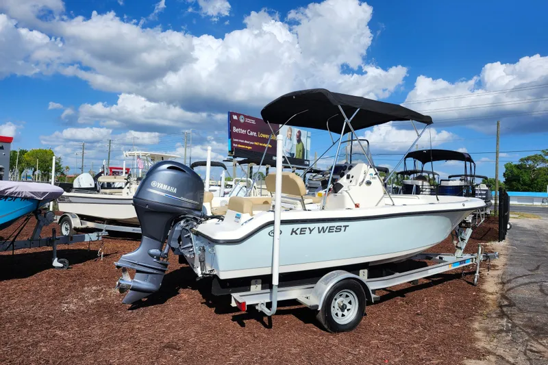 Slide: The Image of 2019 Key West 189 FS boat with Yamaha engine on trailer under blue sky. - 3