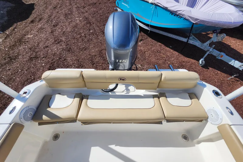 Slide: The Image of 2019 Key West 189 FS boat with beige seating and 115 HP outboard motor. - 34