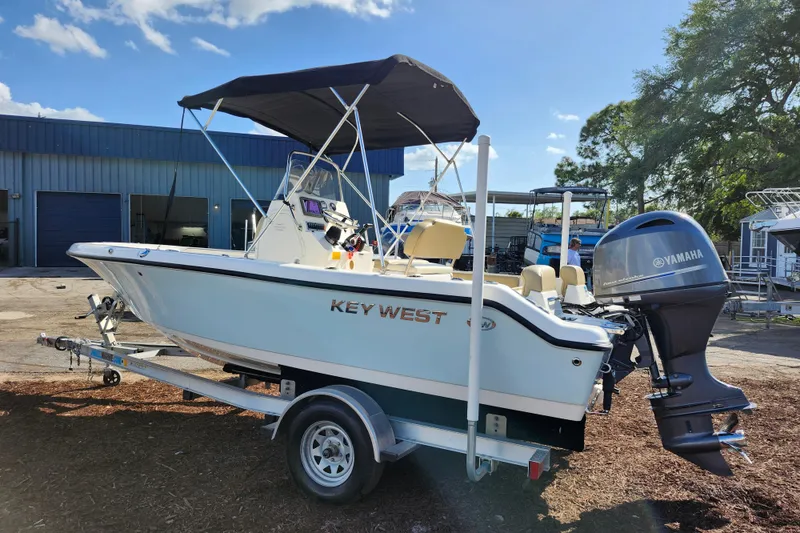 Slide: The Image of 2019 Key West 189 FS boat with Yamaha engine on trailer, parked outdoors. - 5