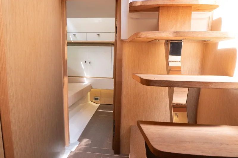 Slide: The Image of 2024 Fjord 41 XP yacht interior with wooden stairs and modern cabin design. - 29