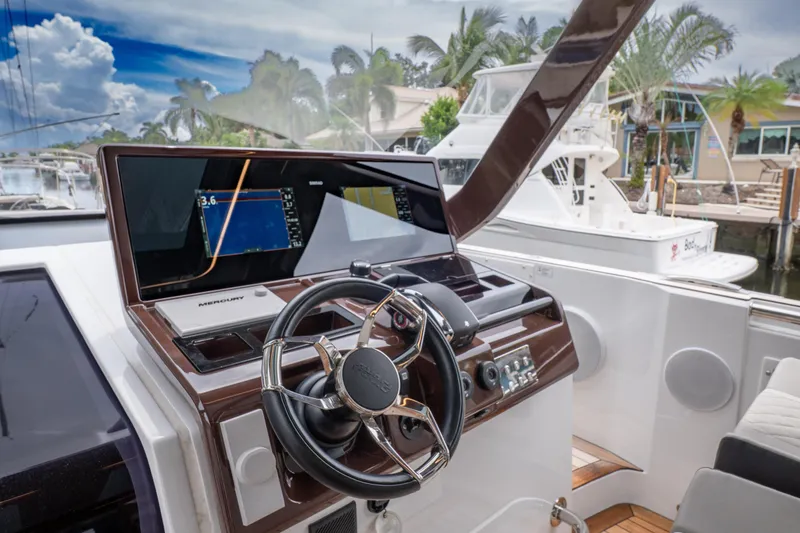 Slide: The Image of 2024 Fjord 41 XP yacht helm with modern navigation system and luxurious design. - 9