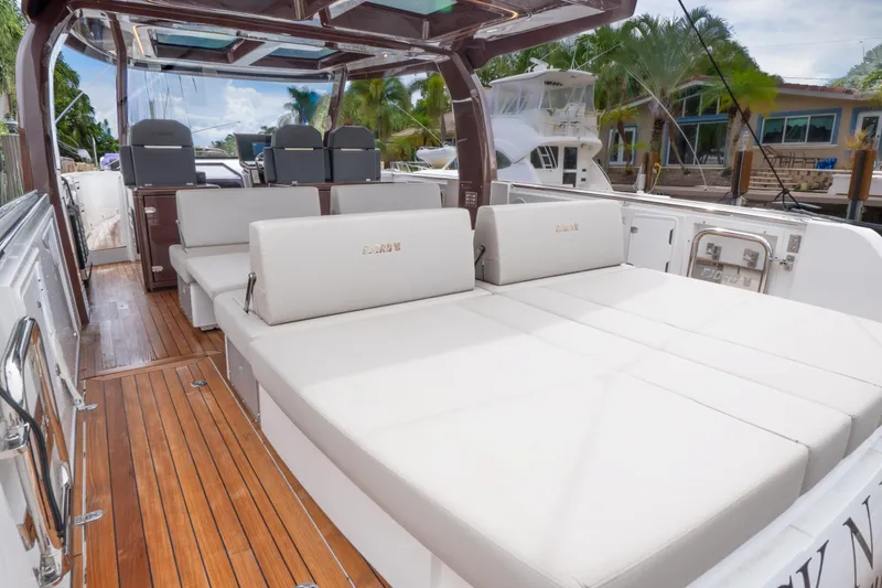 Slide: The Image of 2024 Fjord 41 XP luxury yacht interior with spacious seating and elegant wood flooring. - 4