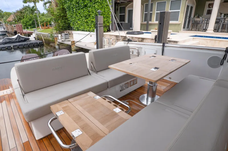 Slide: The Image of Luxurious 2024 Fjord 41 XP yacht interior with elegant seating and wooden tables. - 16