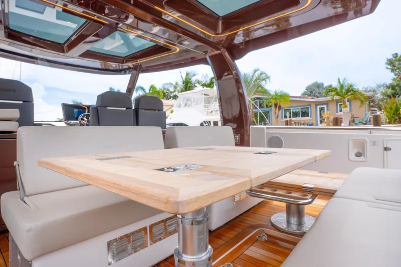 Slide: The Image of Luxurious interior of 2024 Fjord 41 XP yacht with elegant seating and wooden table. - 17