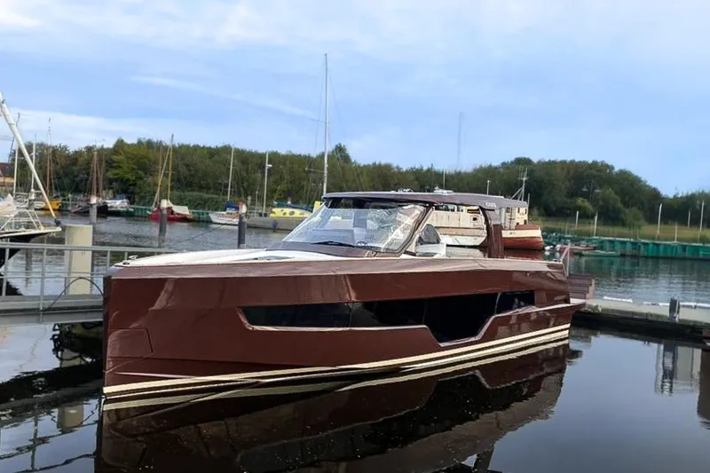 Slide: The Image of 2024 Fjord 41 XP yacht docked in a serene marina setting. - 45