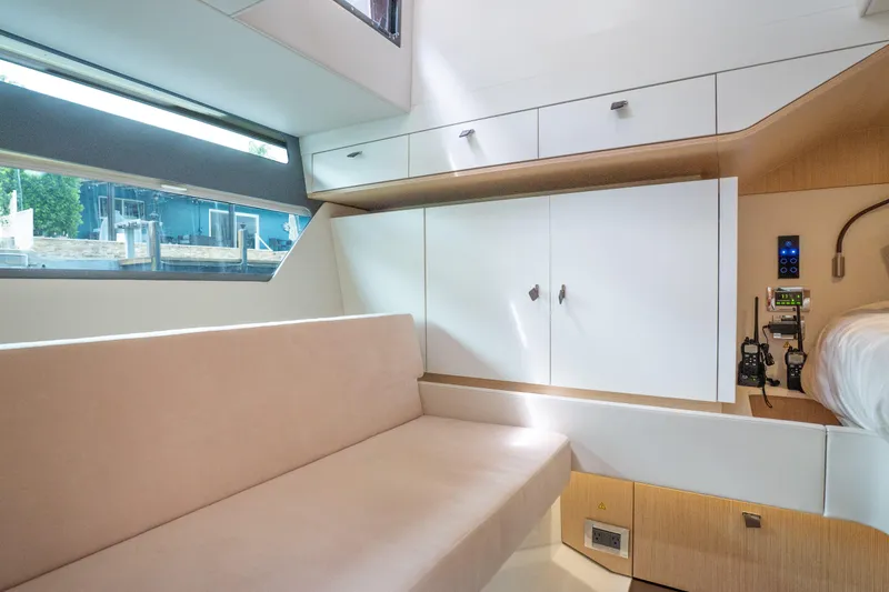 Slide: The Image of 2024 Fjord 41 XP yacht interior with modern seating and sleek cabinetry design. - 32