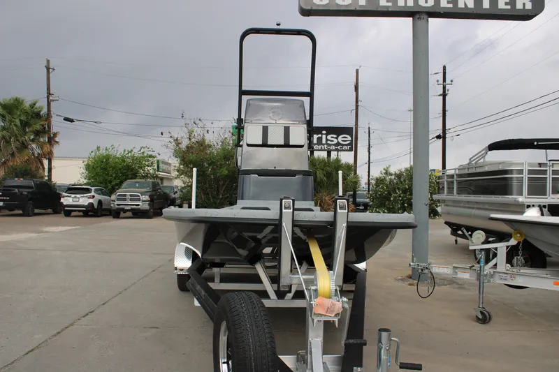 Slide: The Image of 2026 Freedom Boats 24 Defender on trailer at dealership lot. - 11