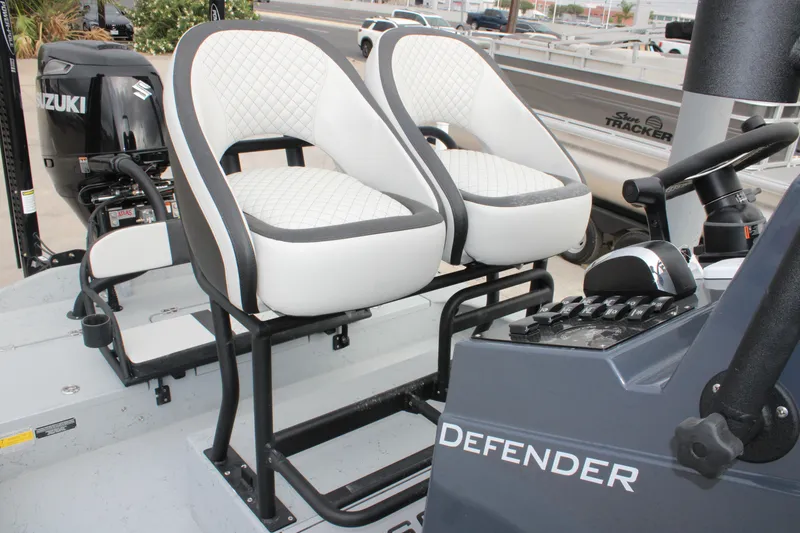 Slide: The Image of 2026 Freedom Boats 24 Defender interior with dual seats and control panel. - 12