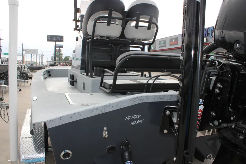 Slide: The Image of 2026 Freedom Boats 24 Defender, rear view, showcasing seating and engine area. - 17