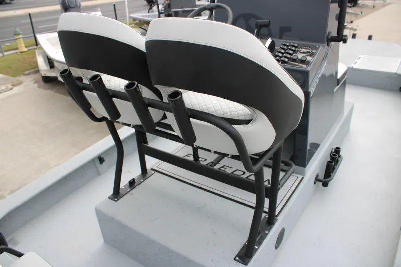 Slide: The Image of 2026 Freedom Boats 24 Defender helm with dual seats and rod holders. - 3