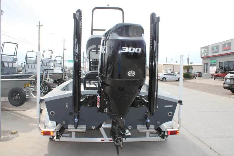 Slide: The Image of 2026 Freedom Boats 24 Defender with powerful 300 HP engine, displayed outdoors. - 7