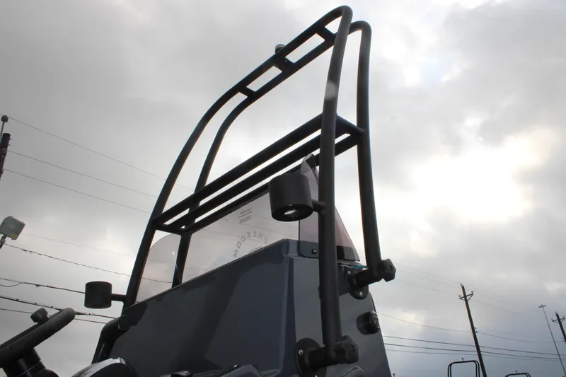 Slide: The Image of 2026 Freedom Boats 24 Defender, close-up of boat's tower against cloudy sky. - 8