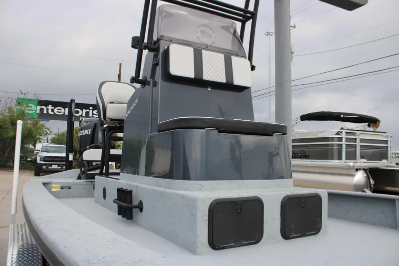 Slide: The Image of 2026 Freedom Boats 24 Defender, sleek design, Suzuki engine, outdoor setting. - 9
