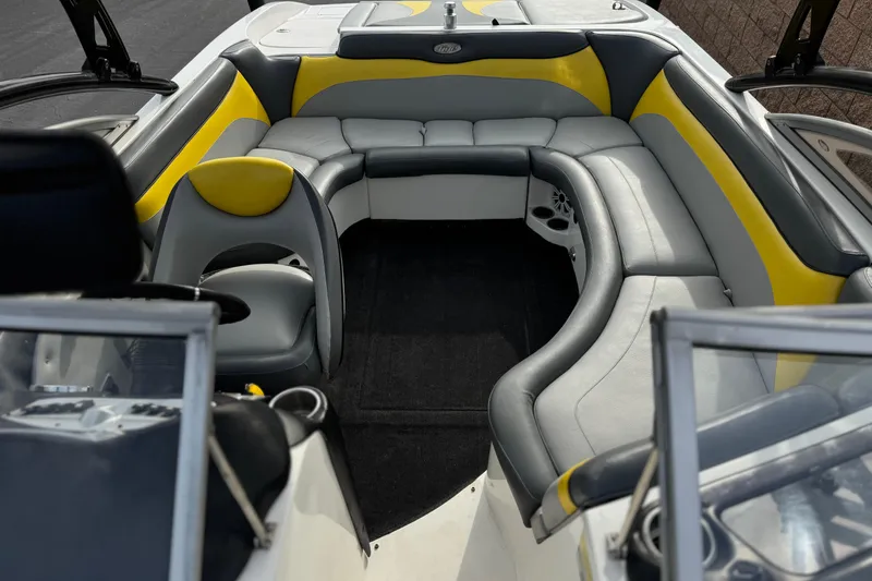 Slide: The Image of Interior of a 2006 Tigé 22V boat with gray and yellow seating. - 14