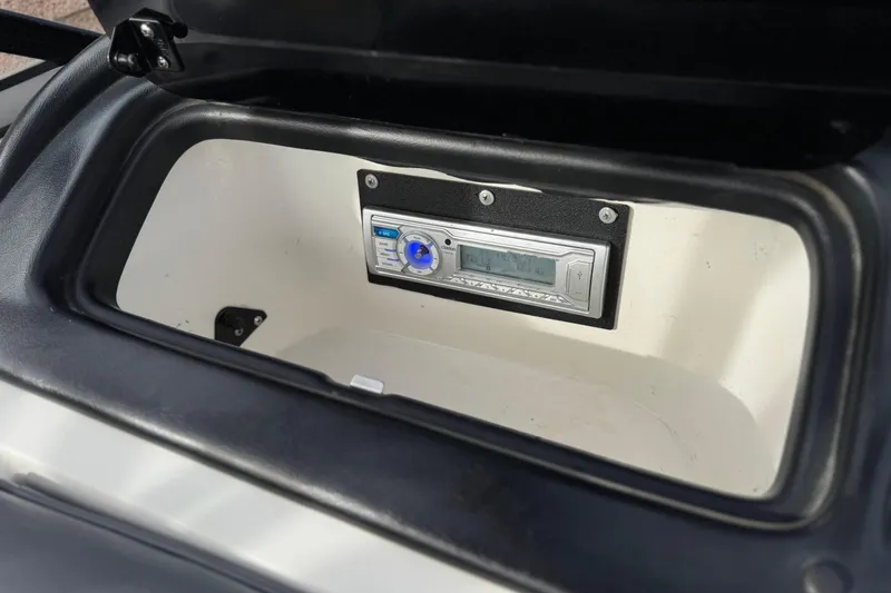 Slide: The Image of 2006 Tigé 22V boat stereo system in storage compartment. - 27