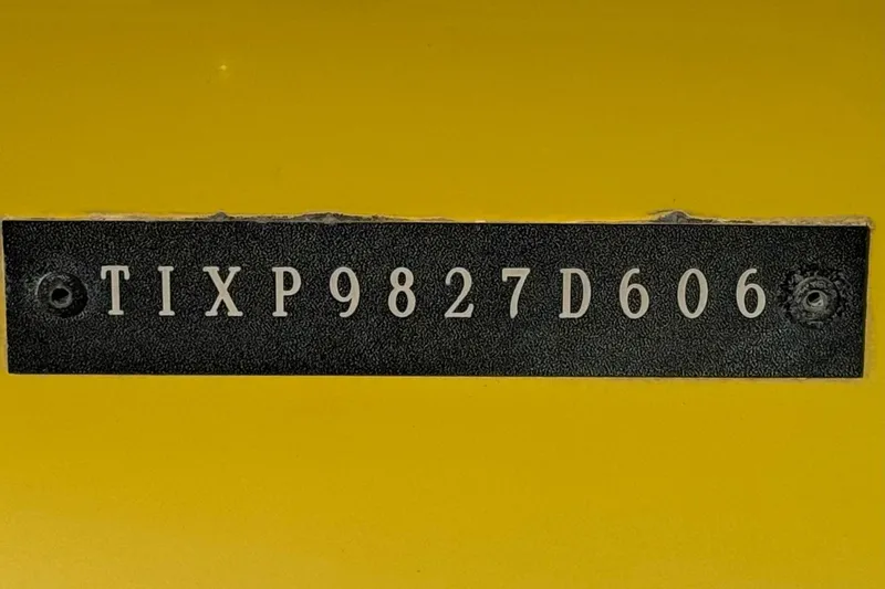 Slide: The Image of 2006 Tigé 22V boat identification number on yellow background. - 36